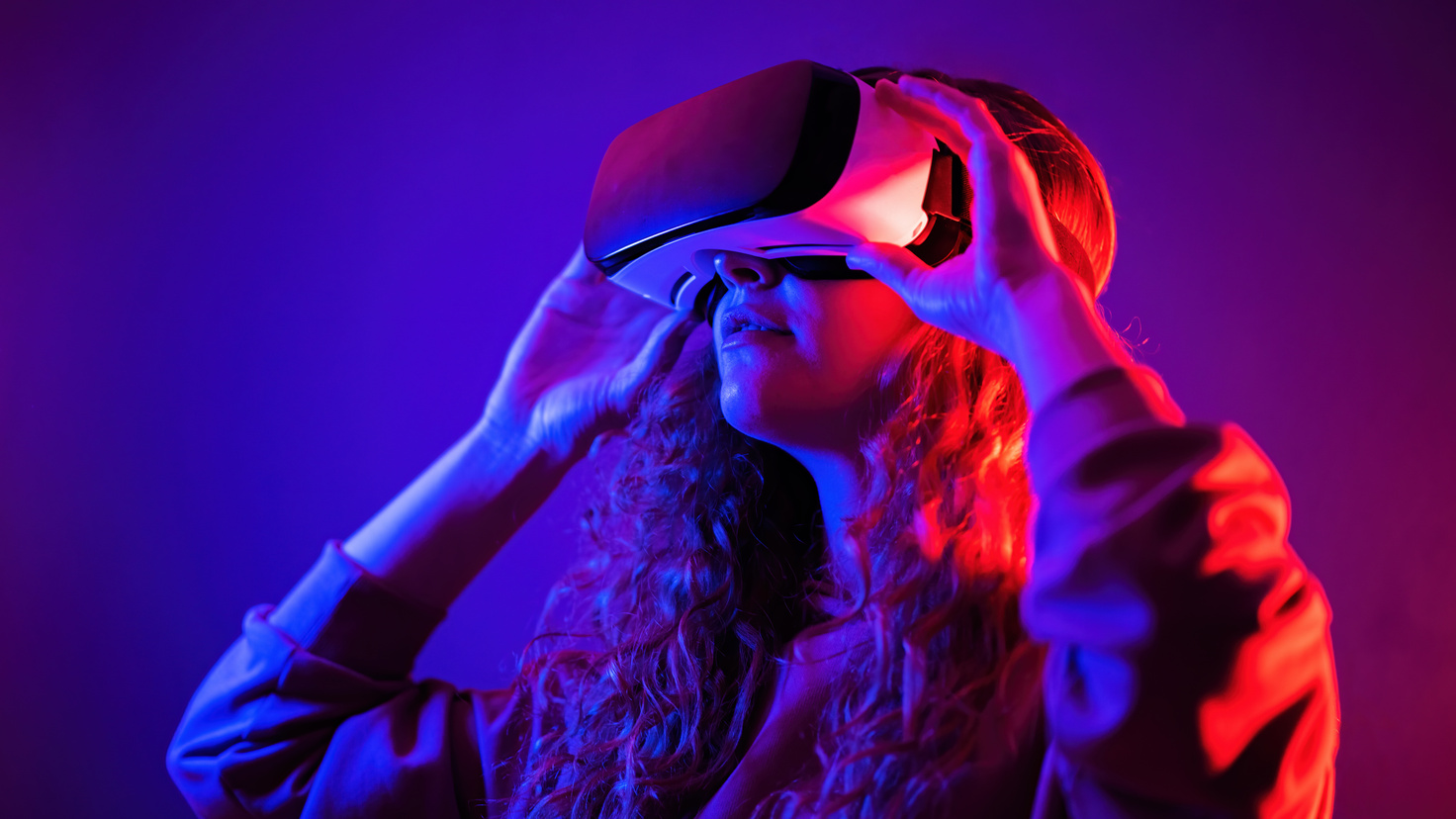 Young Woman Using Virtual Reality Glasses 